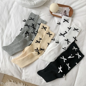 Bow-knot detail on ribbed knit knee-high socks in grey, beige, white, and black colors