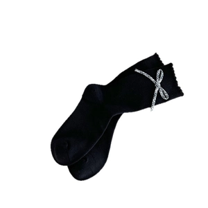 Black mid-calf knit socks with ruffled edges and vintage grey plaid bow decoration