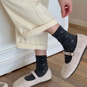 Retro grey floral pattern crew socks with lace trim paired with stylish Mary Jane shoes