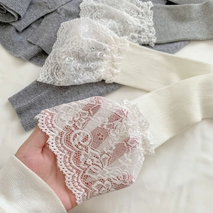 Close-up of ivory white lace trim and vertical knit texture on elegant JK style socks