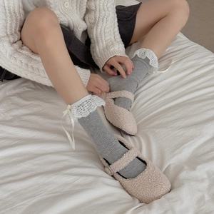 Grey Lolita socks with white lace trim and ribbon bows paired with beige plush Mary Janes