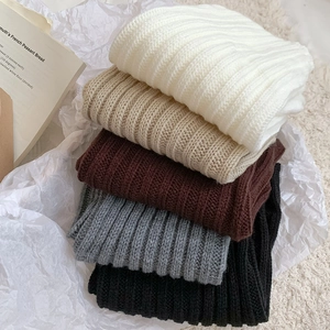 Detail of ribbed knit texture showing 5 neutral colors for leg warmers and scarves