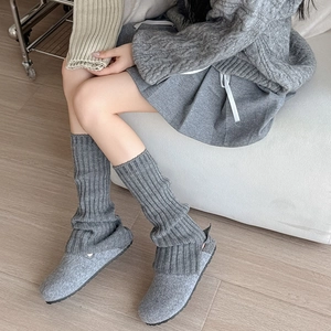 Gray vertical ribbed knit leg warmers for women with split hem design for winter warmth