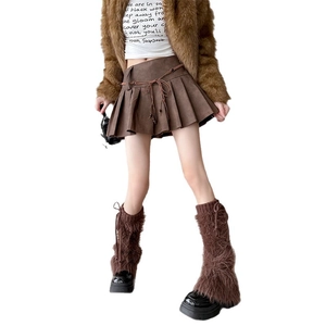 Dark brown pleated mini skirt with fringe belt shown on model over white background