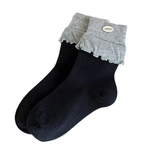 Blue and gray contrast knit crew socks with ruffled cuffs and button detail for women