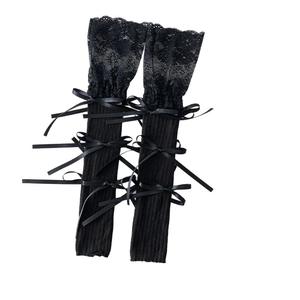Black knit leg warmers with floral lace trim and satin bow ties in Lolita style