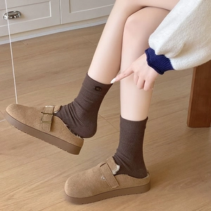 Brown faux suede mule slippers with plush lining and decorative metal buckle strap