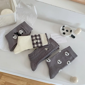 Detailed set of grey and cream cotton socks featuring cute puppy and bow embroidery