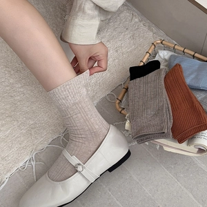 Detailed texture of cotton ribbed crew socks in various colors for casual styling
