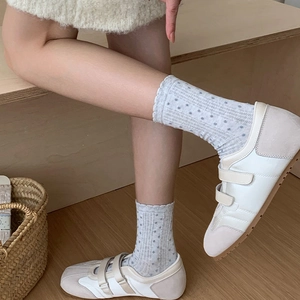 Retro Japanese white lace socks with gray polka dots paired with casual sneakers