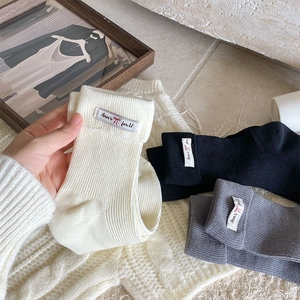 Detailed close-up of ribbed texture and fabric label on these stylish cotton crew socks