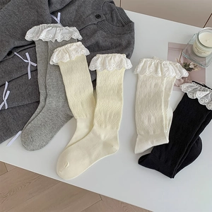 Detail view of cotton lace socks in four colors with delicate embroidered floral edges