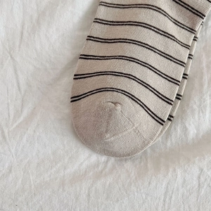 Macro detail of high-quality knitted seams and striped texture on cotton socks