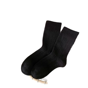 Classic black mid-calf cotton crew socks with vertical ribbed texture for women