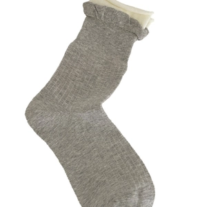 Cute gray polka dot crew socks for women featuring beige double ruffled lettuce trim cuffs