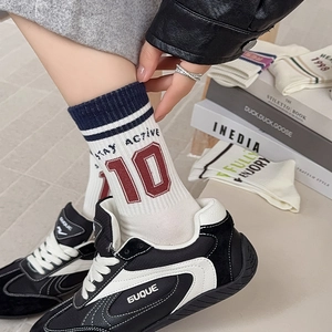 Retro athletic cotton crew socks with navy stripes and red number 10 for sports