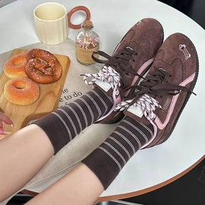Brown retro platform sneakers with corduroy fabric and striped mid-calf socks