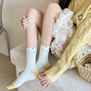 Japanese style white knit mid-calf socks with yellow contrast toe and polka dot trim