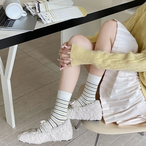 Chic white mid-calf socks with yellow and black horizontal stripes in ribbed cotton knit