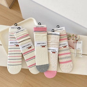 Detail of five-pair knit mid-calf socks set with assorted stripe and dot patterns