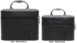Macro detail of two black PU leather cosmetic cases with bows and silver handles