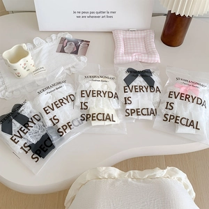 Detail of sweet Lolita mid-calf socks with lace trims and bows in 5-pack gift bags