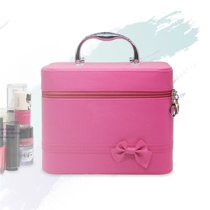 Pink PU leather makeup train case with elegant bow detail and metal handle for travel