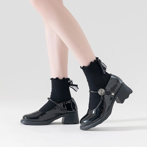 Lolita black Mary Jane shoes with chunky high heels and bow lace socks in studio