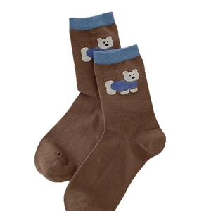 Brown striped socks with cute polar bear motif and blue ribbed cuffs for women