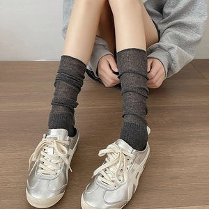Dark grey calf-length slouch socks with vertical stripes for a slim ballet style look