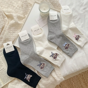 Detail of five pairs of crew socks featuring cat embroidery and 3D bowknot ribbons