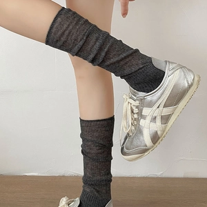 Close-up of charcoal grey calf socks with ribbed texture and ballet style design