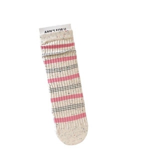 Speckled knit crew socks featuring pink and grey stripes with ribbed texture on white background