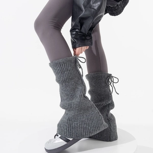 Dark grey knitted leg warmers with drawstring bows and flared bottom for a JK style look