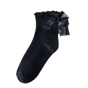 Lolita style black ribbed crew socks featuring ruffle lace trim and silk satin bows