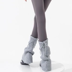Light gray knit leg warmers with drawstring and ribbed texture in flare style