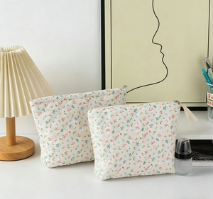 Close-up of quilted cotton floral makeup bags with metal zippers and ribbon pullers
