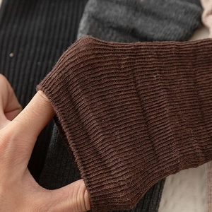 Detailed macro view showing high elasticity and ribbed texture of knitted cotton socks