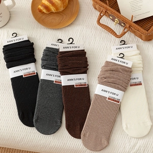 Five pairs of striped knit cotton slouch socks in autumn colors with detailed texture