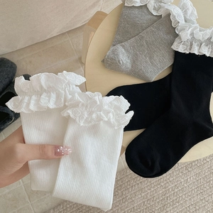 Close-up of sweet heart lace trim socks in black white and grey ballet style