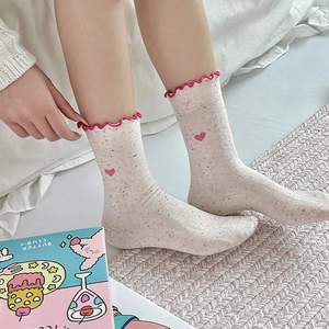 Sweet heart embroidered crew socks with colorful speckles and pink wavy edge design