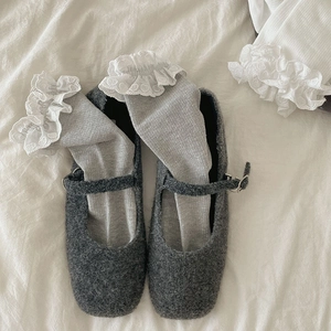 Detail of grey Mary Jane shoes paired with heart lace trim cotton crew socks in ballet style