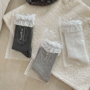 Detailed view of heart lace trim cotton socks in black, grey, and white packaging