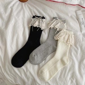 Three-pack ballet style lace trim socks with bows in black, grey, and cream colors
