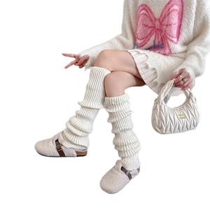 Women's cream white cable knit thigh high leg warmers in stylish slouchy ribbed design
