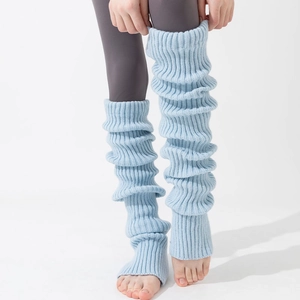 Long light blue knitted leg warmers with vertical ribbed texture and over-knee length