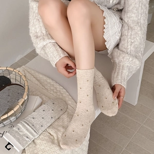 Beige and gray floral embroidered crew socks with rib knit texture for women