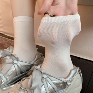 Close-up of high-elasticity breathable cream white crew socks with ribbed cuffs