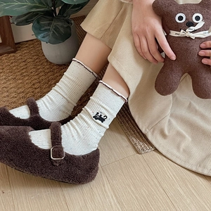 Japanese style cream ribbed socks with colorful specks and cat embroidery detail
