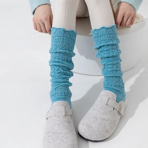 Sky blue hollow knit leg warmers with wave patterns for women in a minimalist style